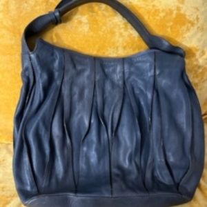 COCCINELLE ITALIAN LEATHER PURSE. USED ONLY TWICE.